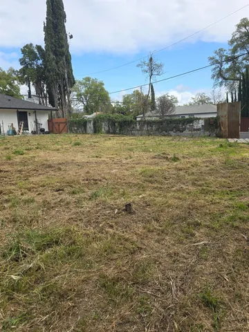 a house view with swimming pool in front of house
