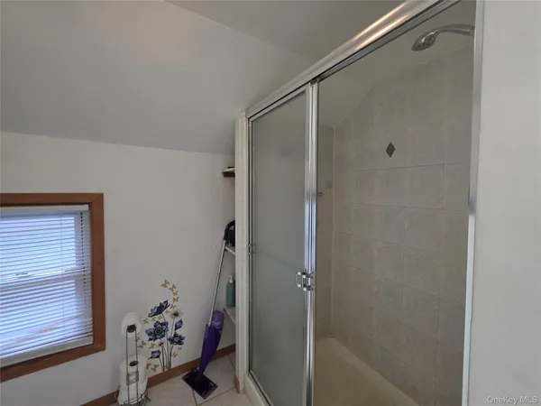 a bathroom with a bathtub and shower
