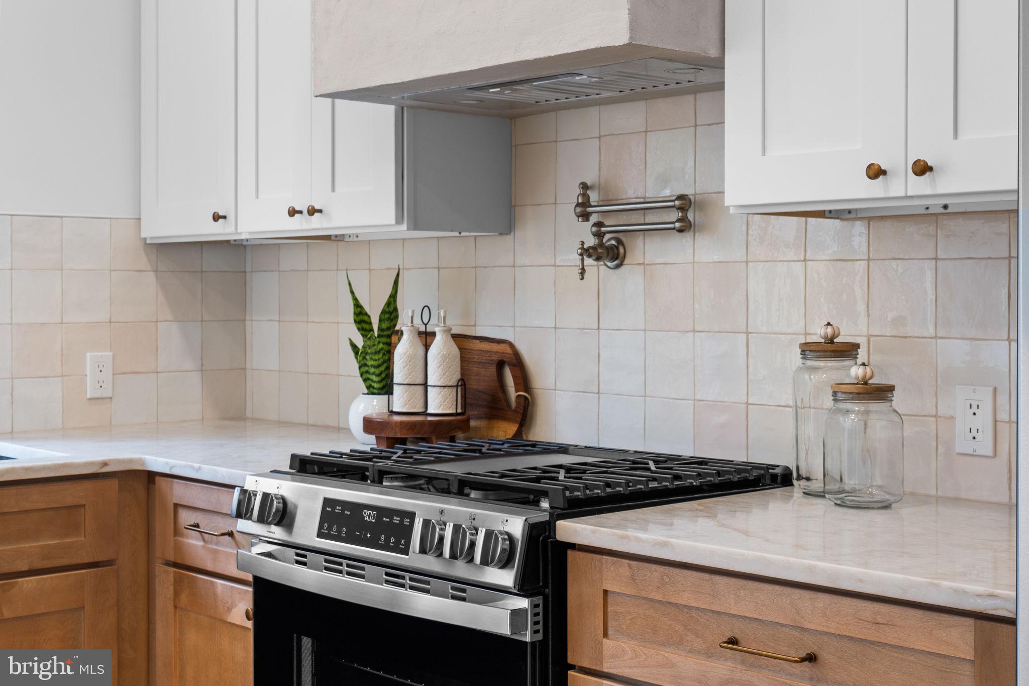 404 Pierce Street Philadelphia, PA 19148 - Photo 14 of 31 a stove top oven sitting inside of a kitchen