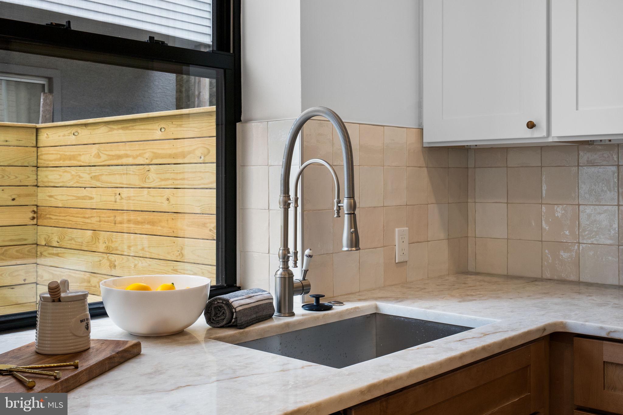 404 Pierce Street Philadelphia, PA 19148 - Photo 15 of 31 a bathroom with a sink and a window
