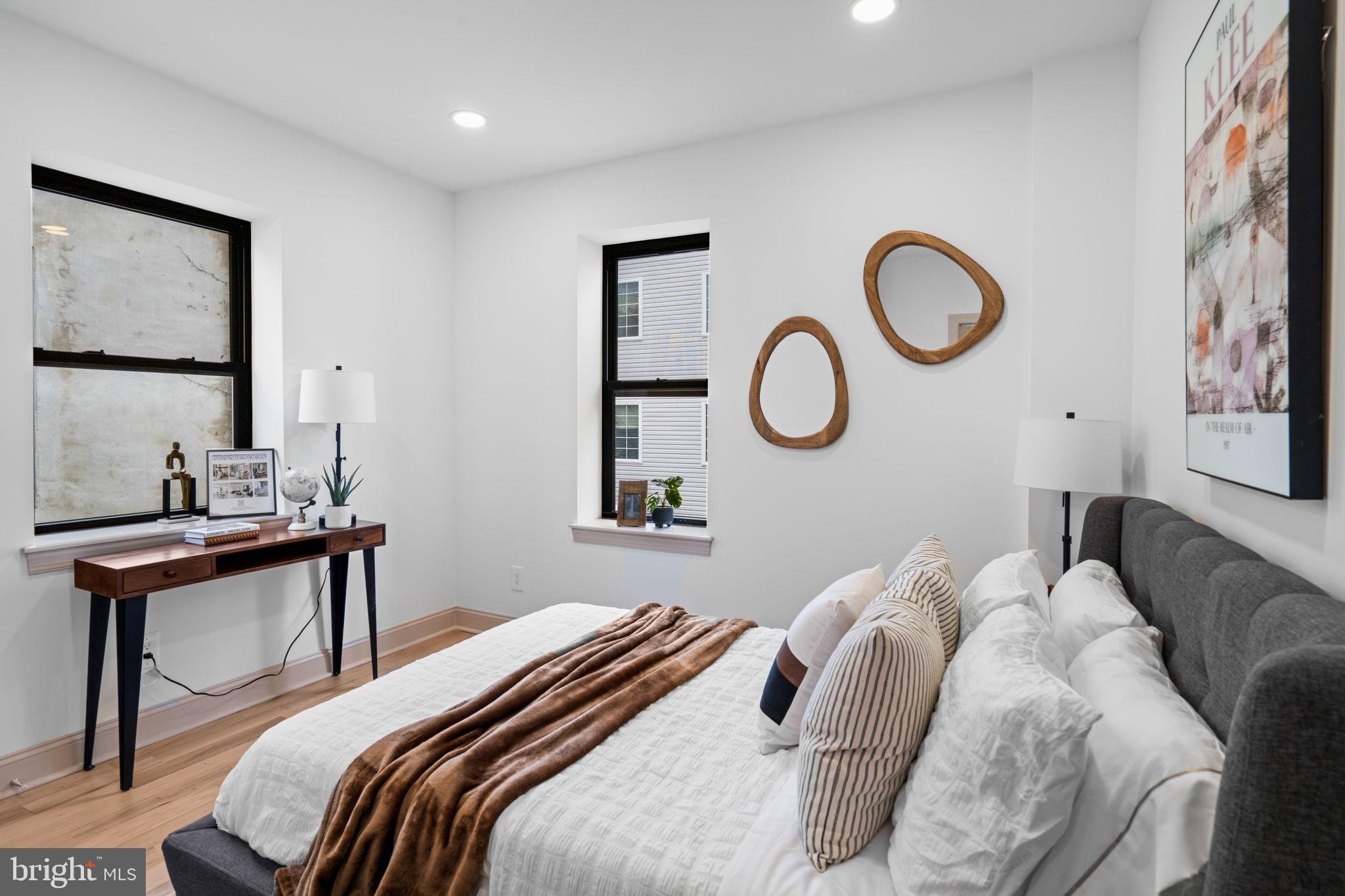 404 Pierce Street Philadelphia, PA 19148 - Photo 18 of 31 a bedroom with a bed and a table