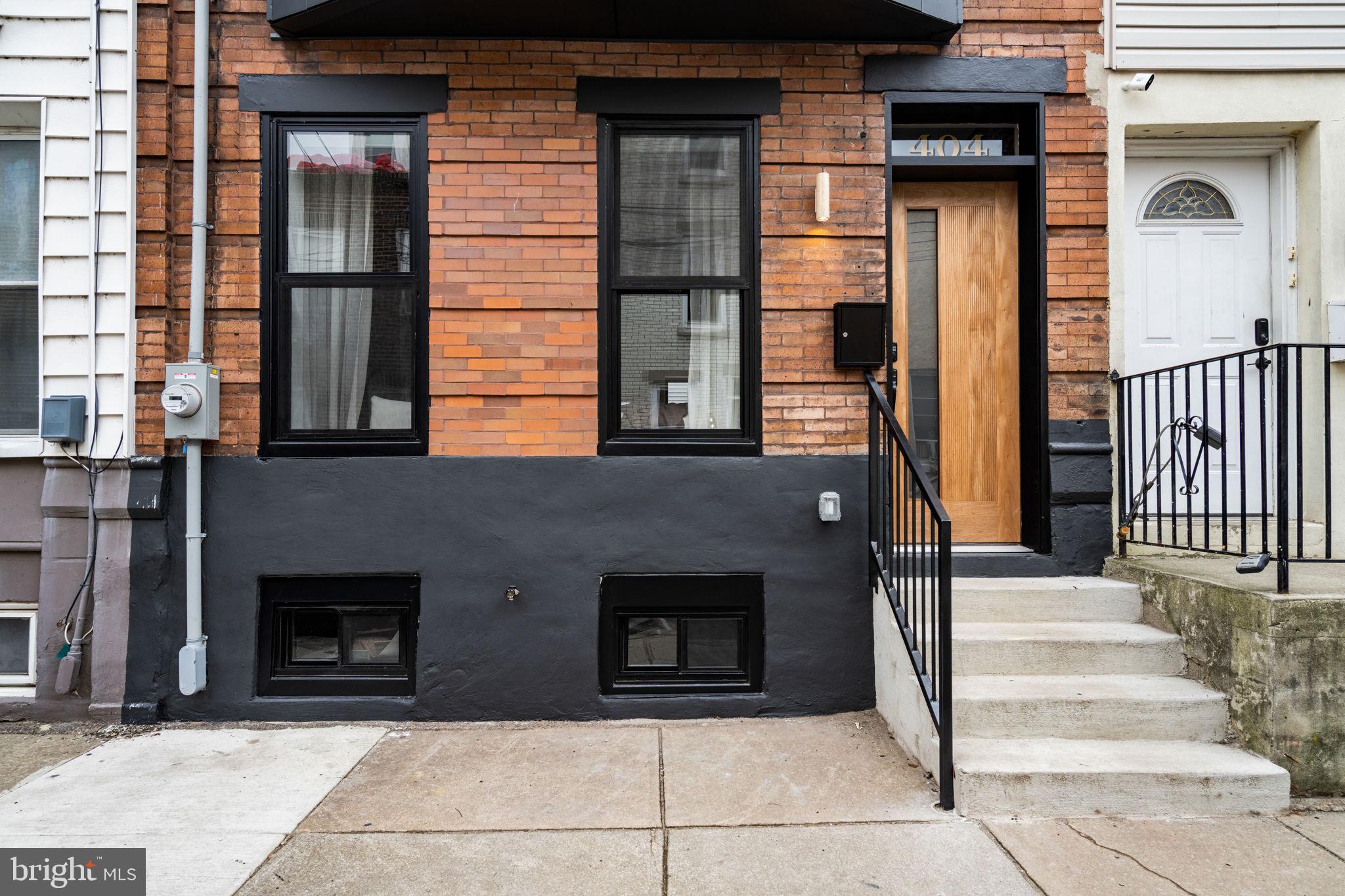 404 Pierce Street Philadelphia, PA 19148 - Photo 3 of 31 a front view of a house with large windows