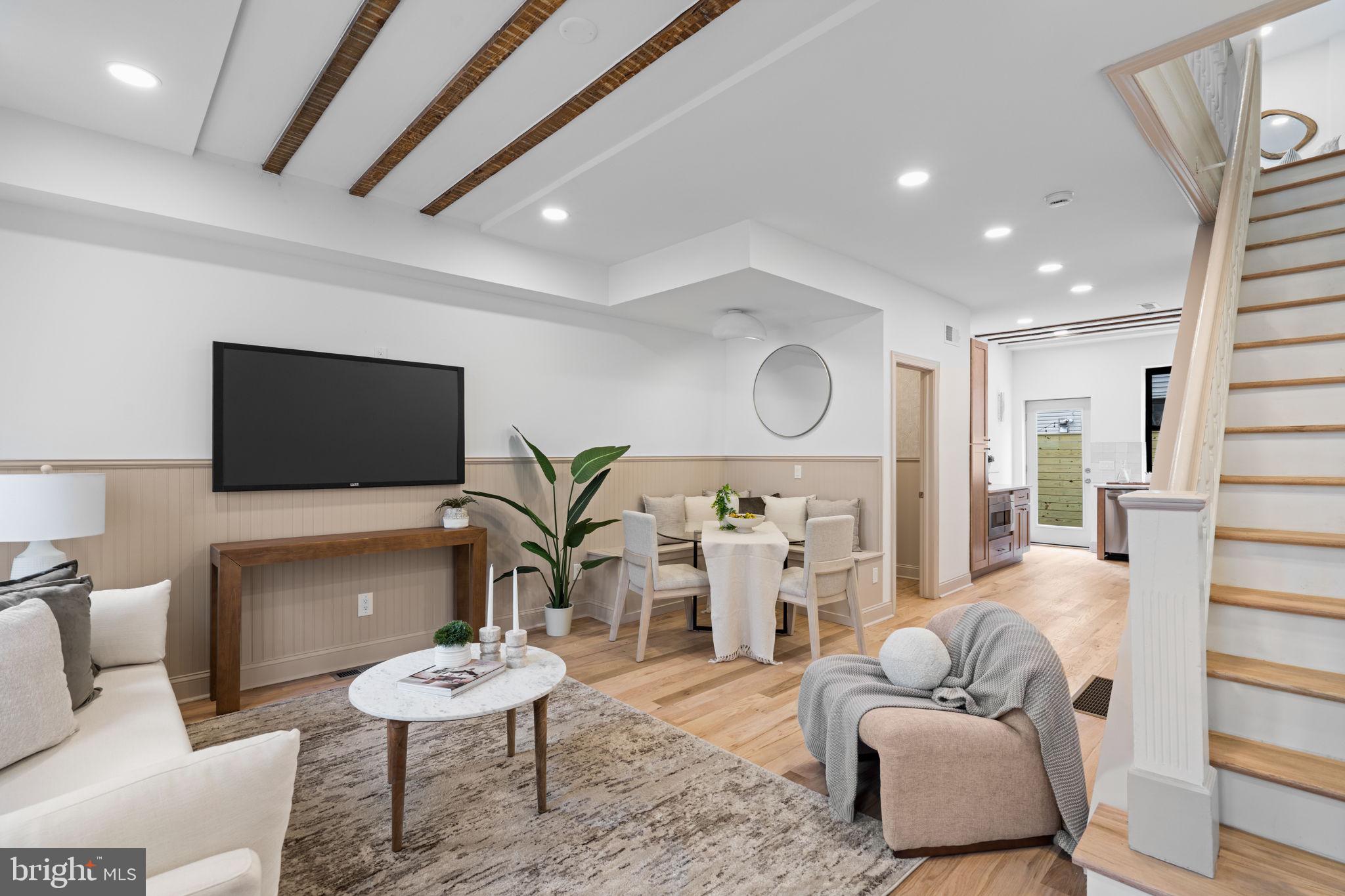 404 Pierce Street Philadelphia, PA 19148 - Photo 4 of 31 a living room with furniture and a flat screen tv