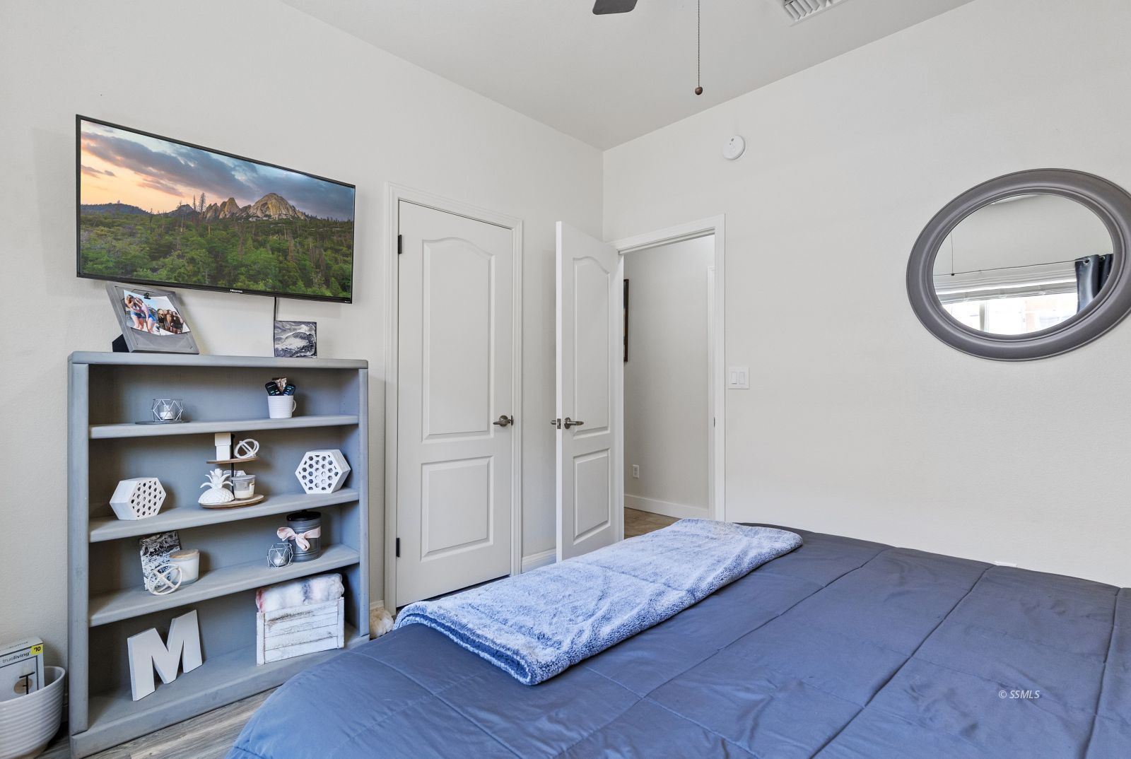 413 Acacia Street Ridgecrest, CA 93555 - Photo 26 of 34 a bedroom with a bed and a flat screen tv
