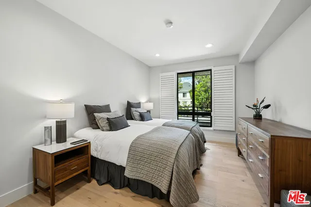 a bathroom with a granite countertop sink mirror and shower