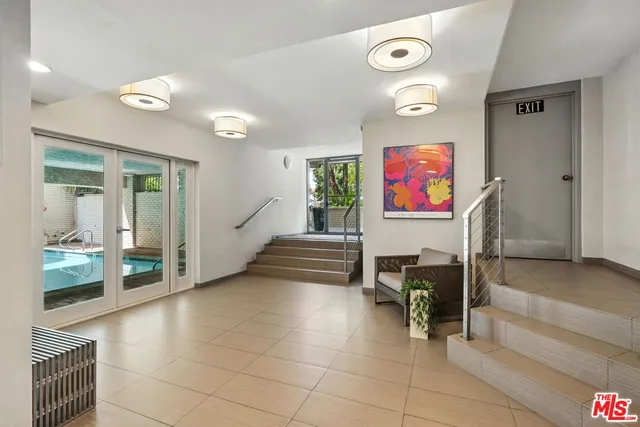 a view of swimming pool with a sitting space