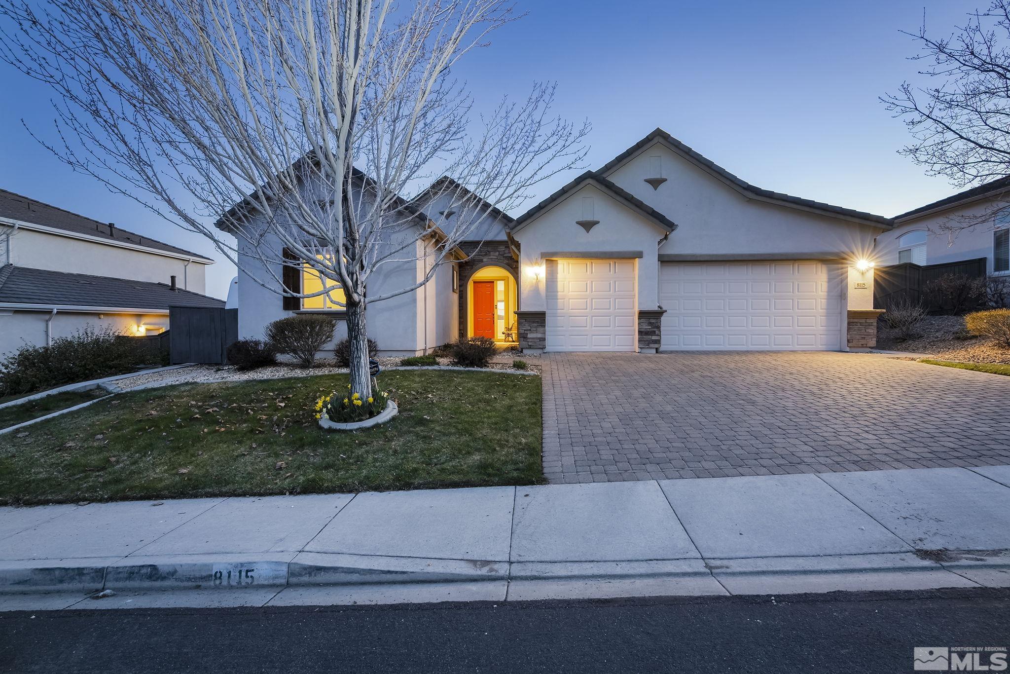 8115 Fire Opal Lane Reno, NV 89506 - Photo 1 of 40 a view of a house with a yard