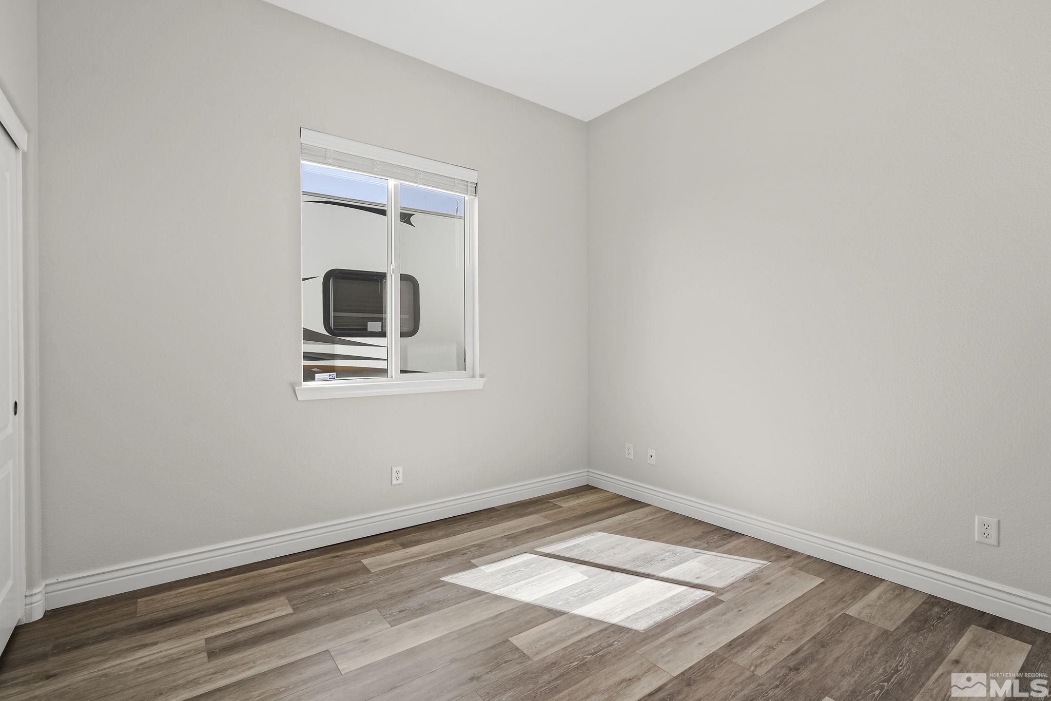 8115 Fire Opal Lane Reno, NV 89506 - Photo 23 of 40 an empty room with a workbench