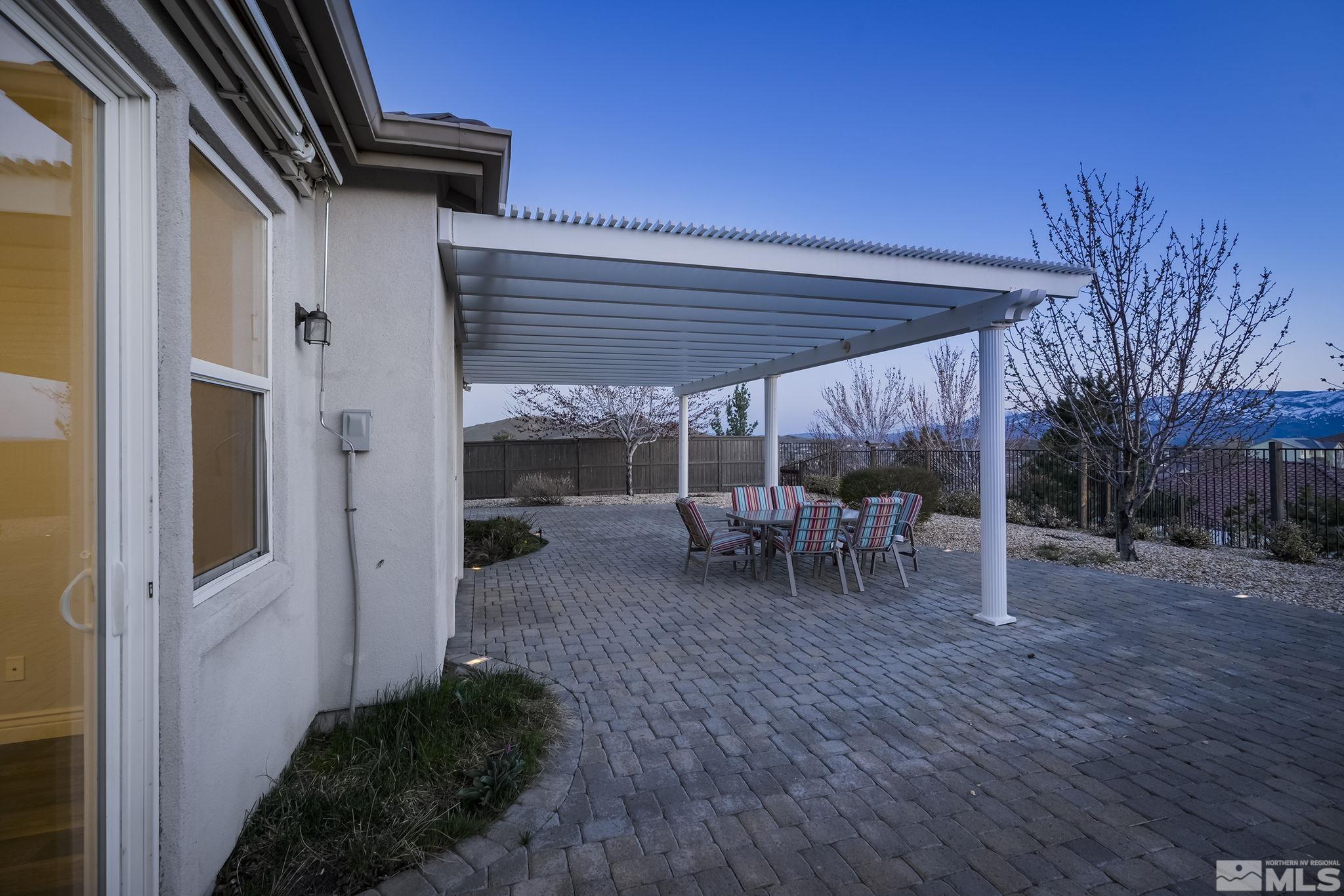 8115 Fire Opal Lane Reno, NV 89506 - Photo 26 of 40 a view of a backyard with a patio and garden