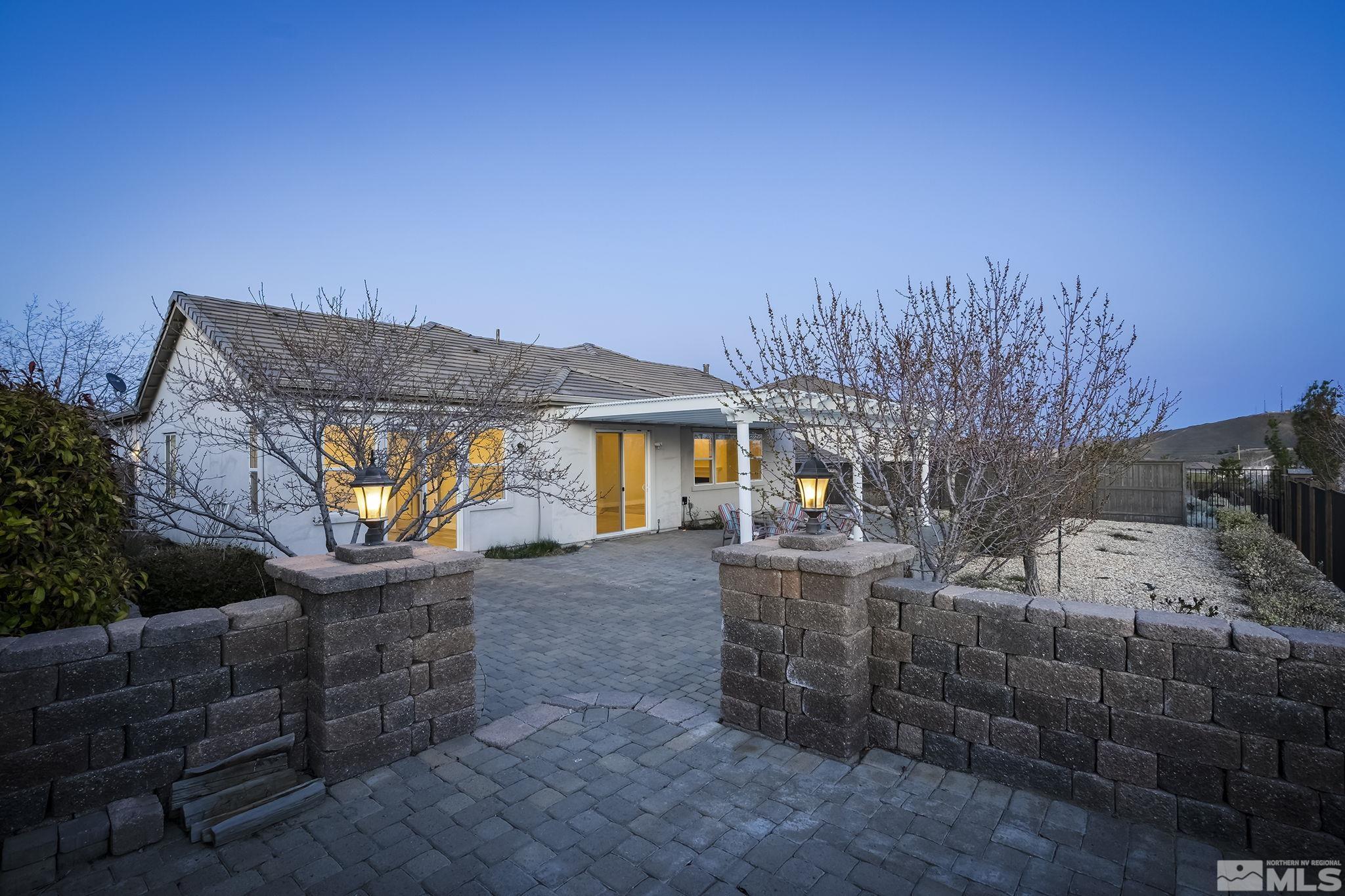 8115 Fire Opal Lane Reno, NV 89506 - Photo 32 of 40 a view of a backyard with furniture