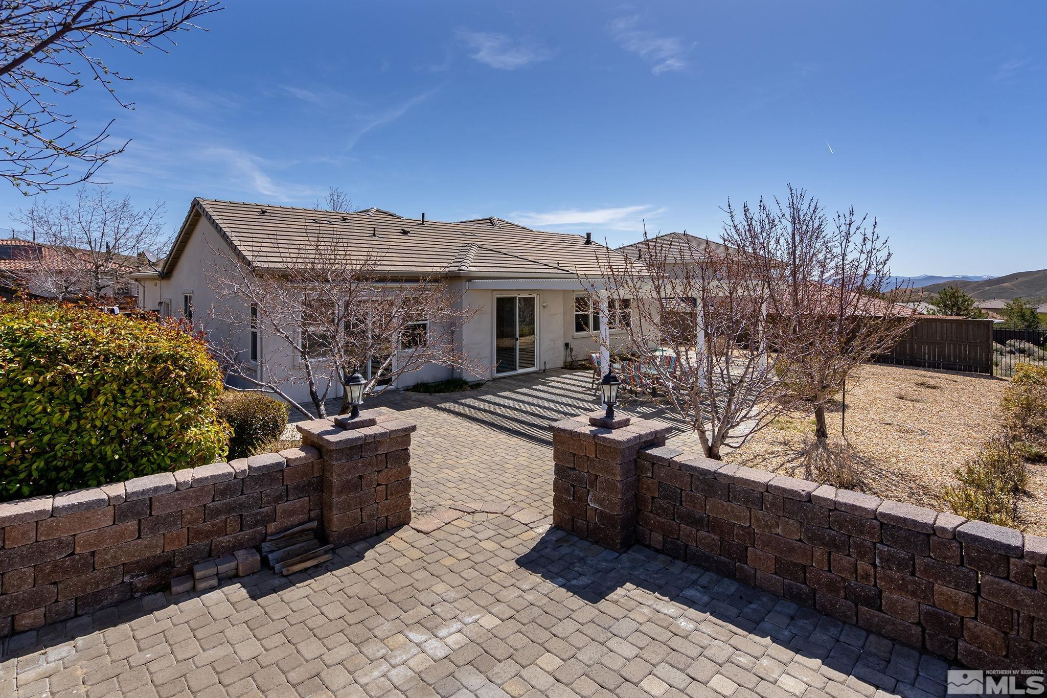 8115 Fire Opal Lane Reno, NV 89506 - Photo 33 of 40 a view of a house with backyard and sitting area