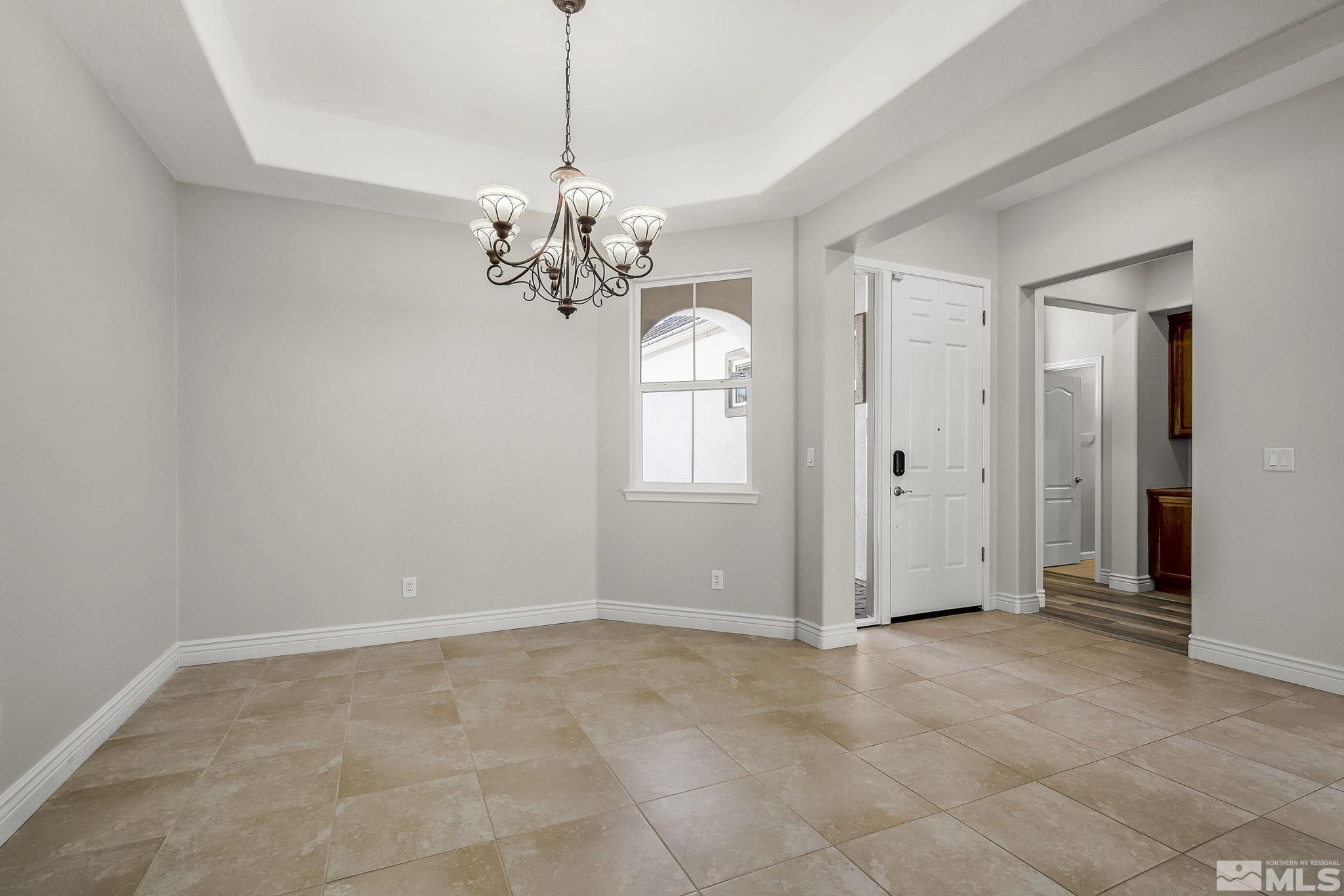 8115 Fire Opal Lane Reno, NV 89506 - Photo 7 of 40 a view of a chandelier in big room and chandelier