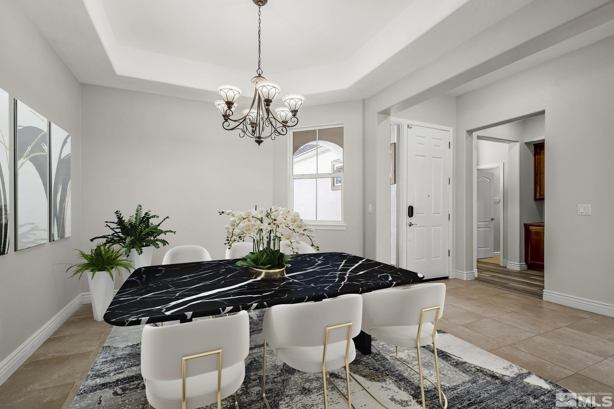 8115 Fire Opal Lane Reno, NV 89506 - Photo 8 of 40 a view of a chandelier and living room