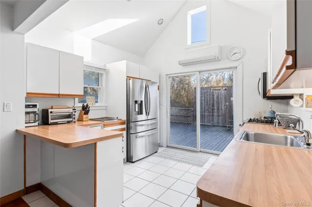 a kitchen with stainless steel appliances granite countertop a sink and cabinets