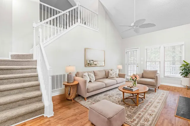 a living room with furniture and a table