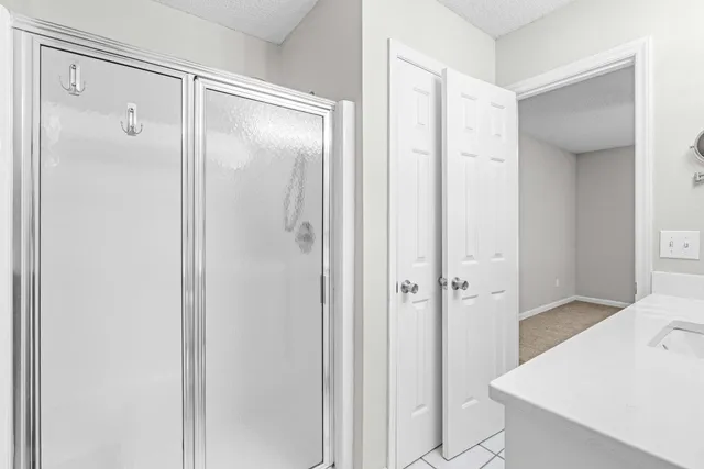 a bathroom with a shower and a sink