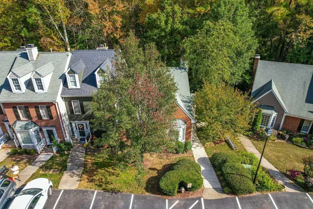 a aerial view of a residential apartment building with a yard