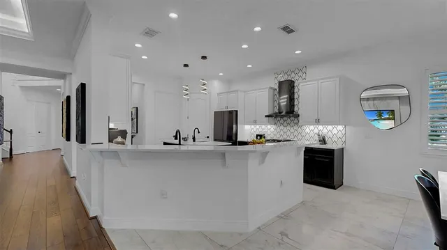 a view of a room with wooden floor and stairs