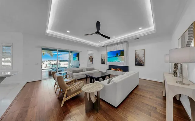 a bedroom with furniture and a large window