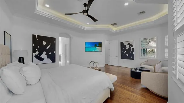 a bathroom with a tub a window and shower