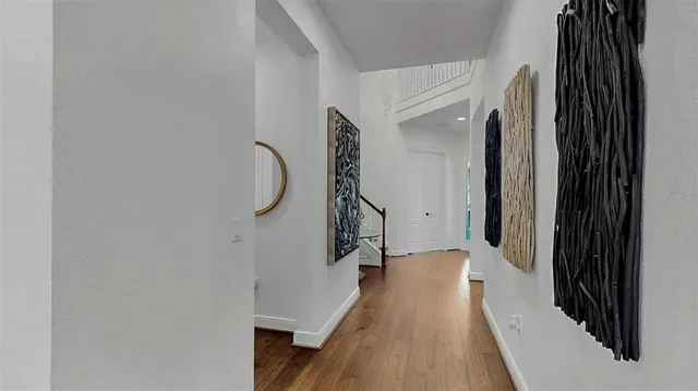 a view of walk in closet with clothes