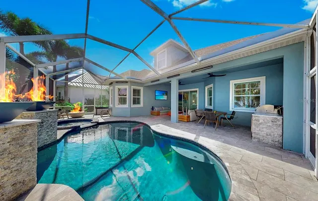 a view of a swimming pool with a patio