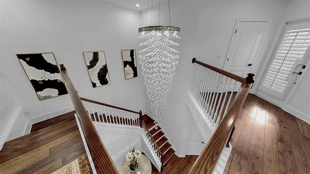 a bathroom with a double vanity sink toilet mirror and shower