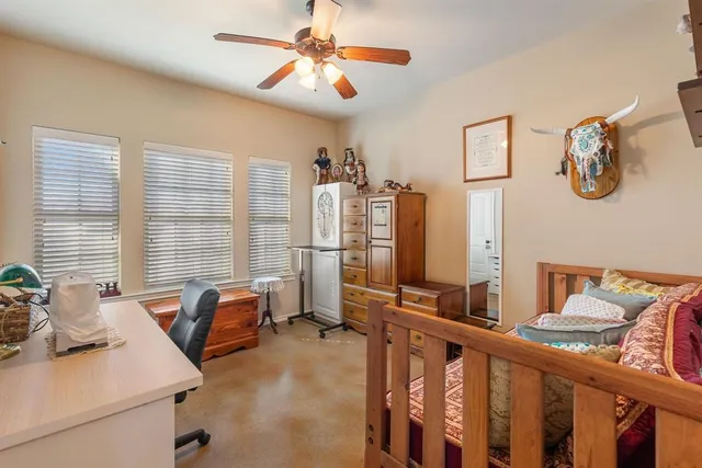 a view of a livingroom with furniture and windows