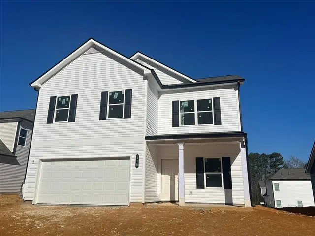 a front view of a house with a garage
