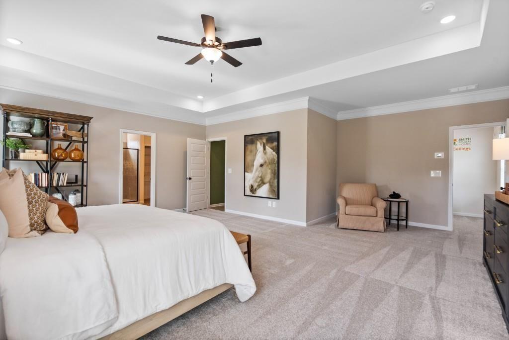 116 Sycamore Lane Calhoun, GA 30701 - Photo 26 of 43 a bedroom with a large bed and a chandelier