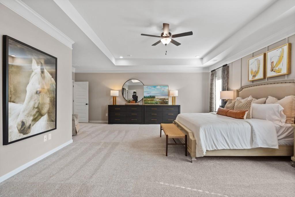 116 Sycamore Lane Calhoun, GA 30701 - Photo 27 of 43 a spacious bedroom with a bed and cabinet