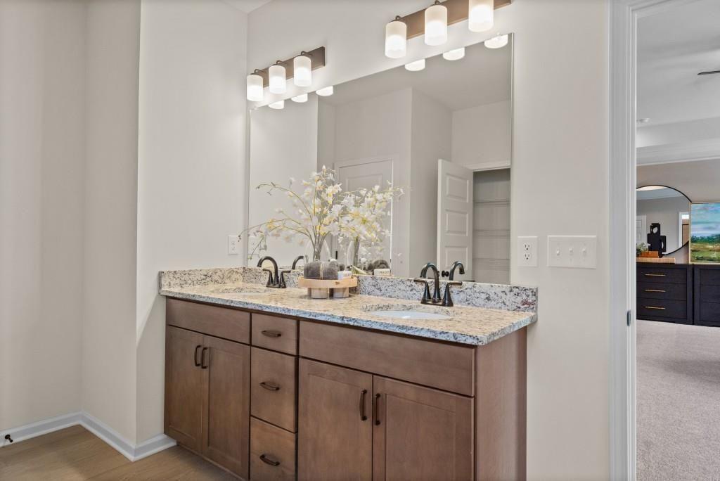 116 Sycamore Lane Calhoun, GA 30701 - Photo 30 of 43 a bathroom with a double vanity sink and a mirror