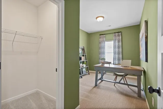 a reading room with furniture and a window