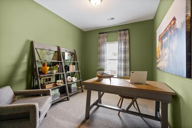 a view of a workspace with furniture