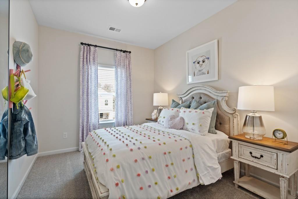 116 Sycamore Lane Calhoun, GA 30701 - Photo 40 of 43 a bedroom with a bed and a window