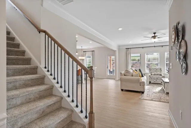 a dining room with furniture and wooden floor