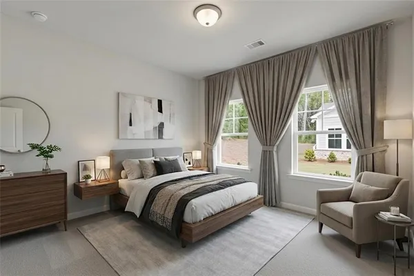 a bedroom with a bed and a couch