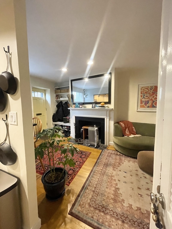 9 Primus Avenue, Unit 1 Boston, MA 02114 - Photo 4 of 19 a living room with furniture and a fireplace