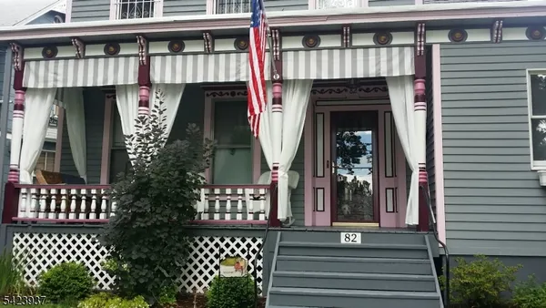 a view of a balcony with wooden floor and fence