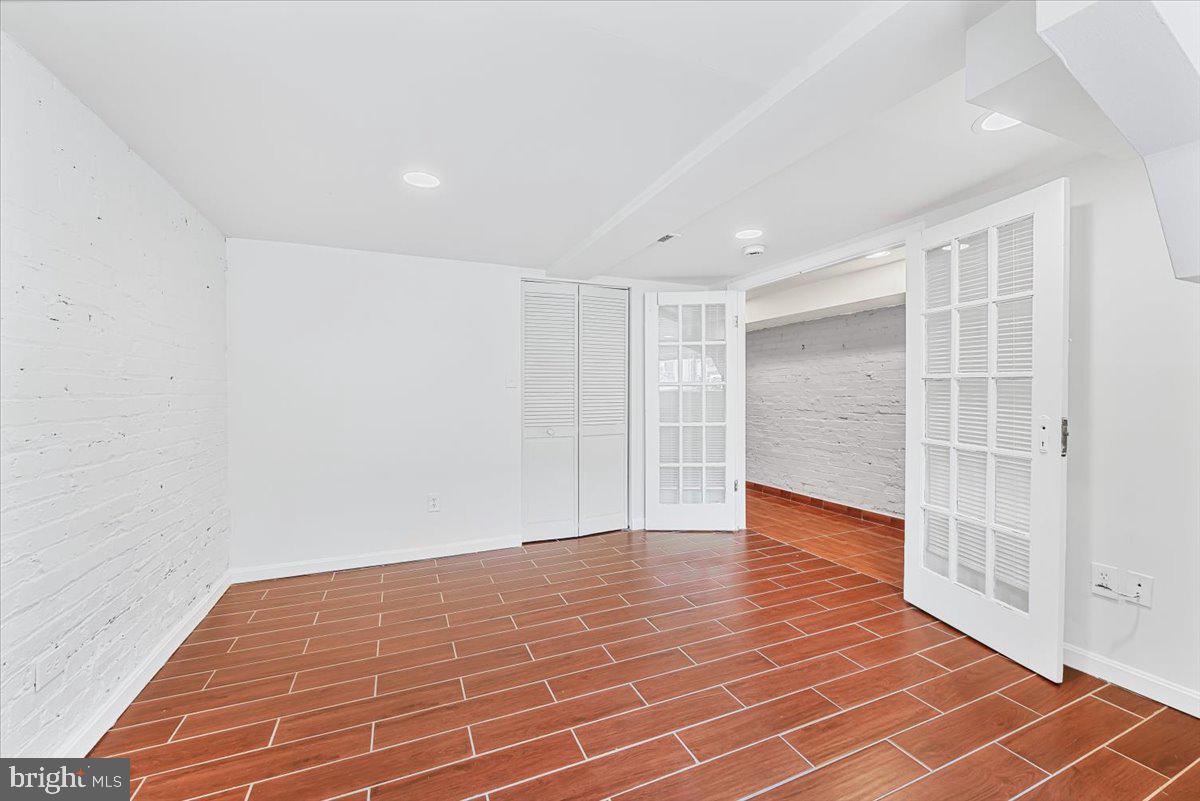 30 R Street Northeast, Unit B Washington, DC 20002 - Photo 7 of 21 a view of an empty room with wooden floor