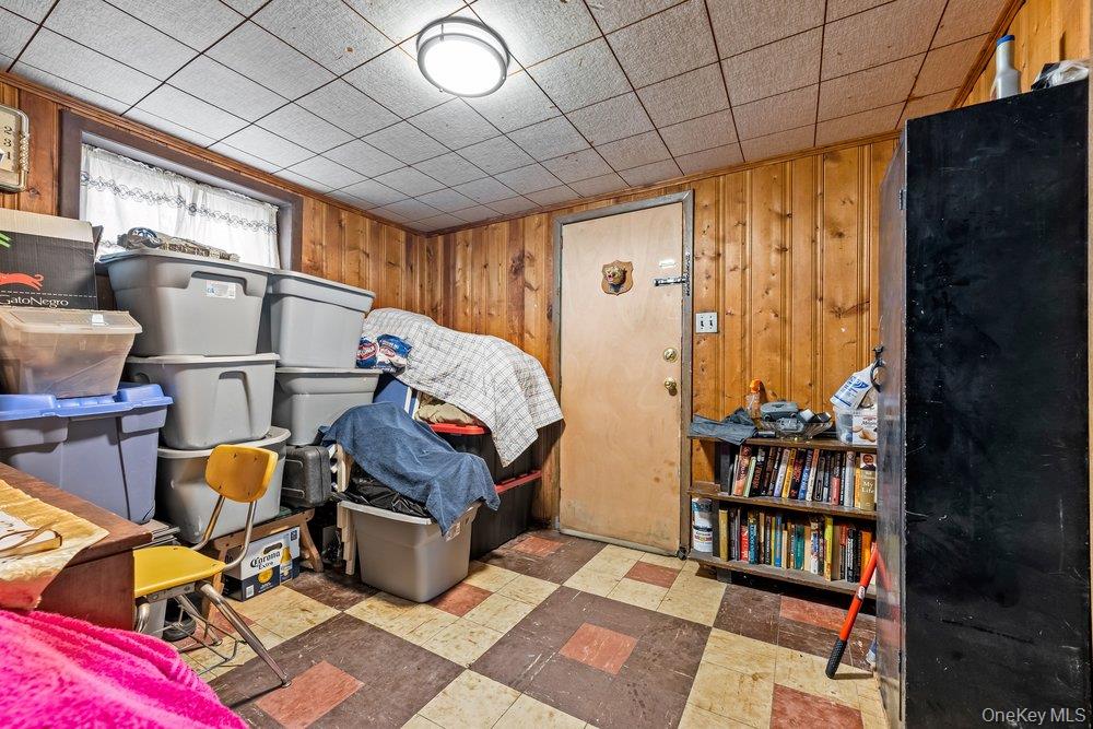 145-95 221st Street Queens, NY 11413 - Photo 22 of 38 a room with lots of furniture and a rug