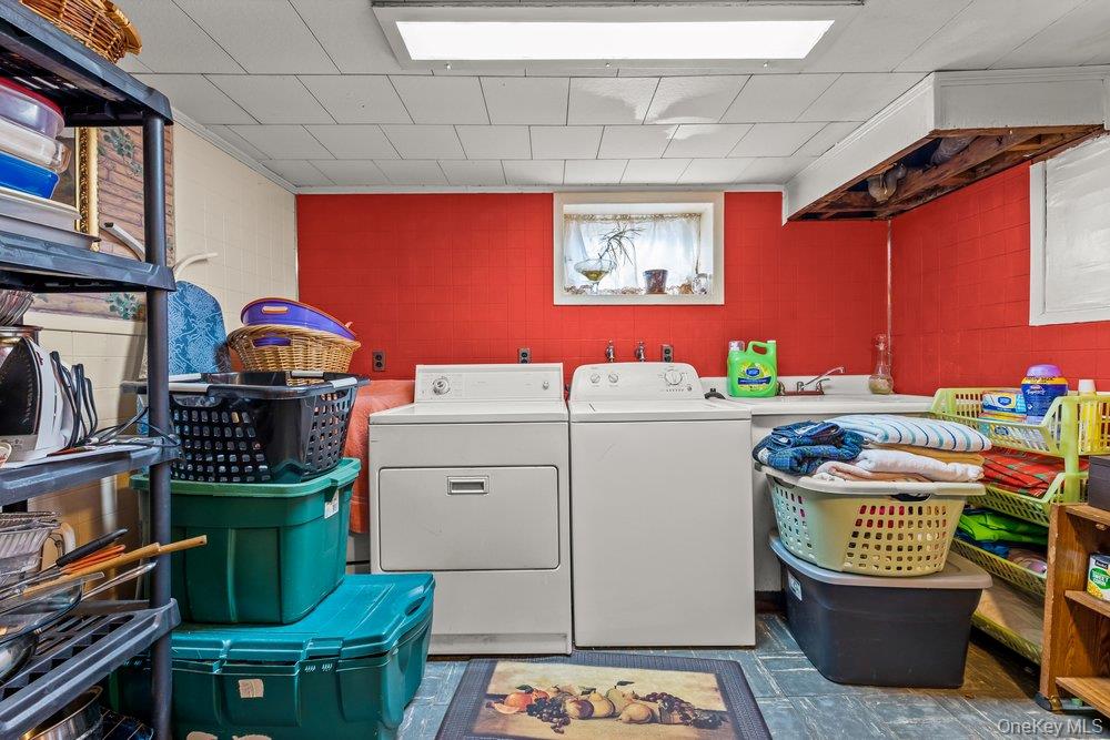 145-95 221st Street Queens, NY 11413 - Photo 25 of 38 a utility room with dryer and washer