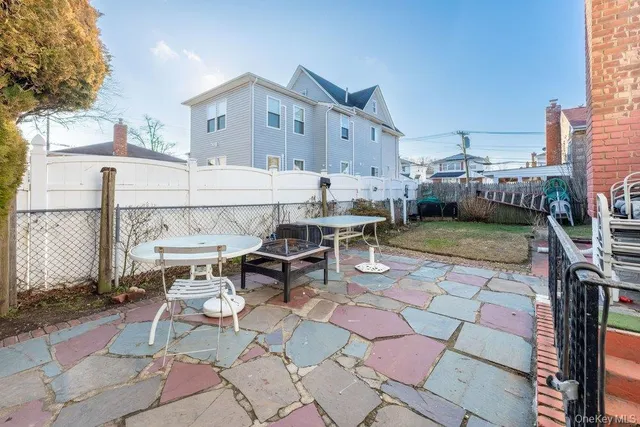 a view of a balcony with a table and chairs