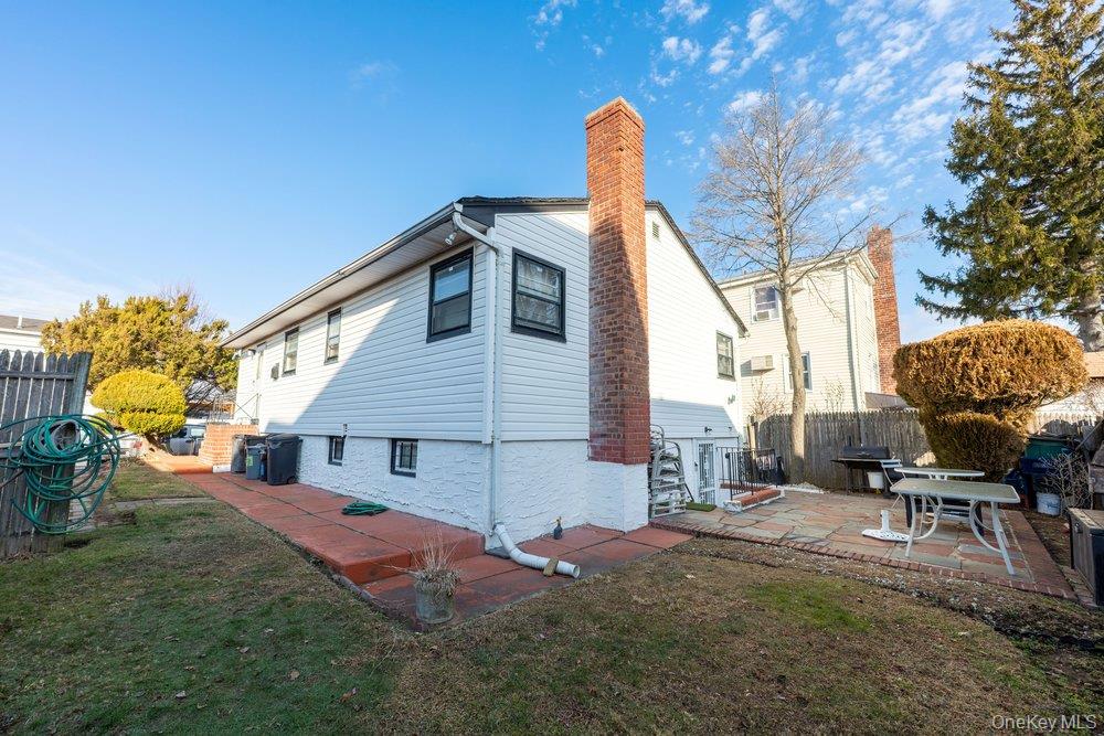 145-95 221st Street Queens, NY 11413 - Photo 38 of 38 a front view of a house with garden