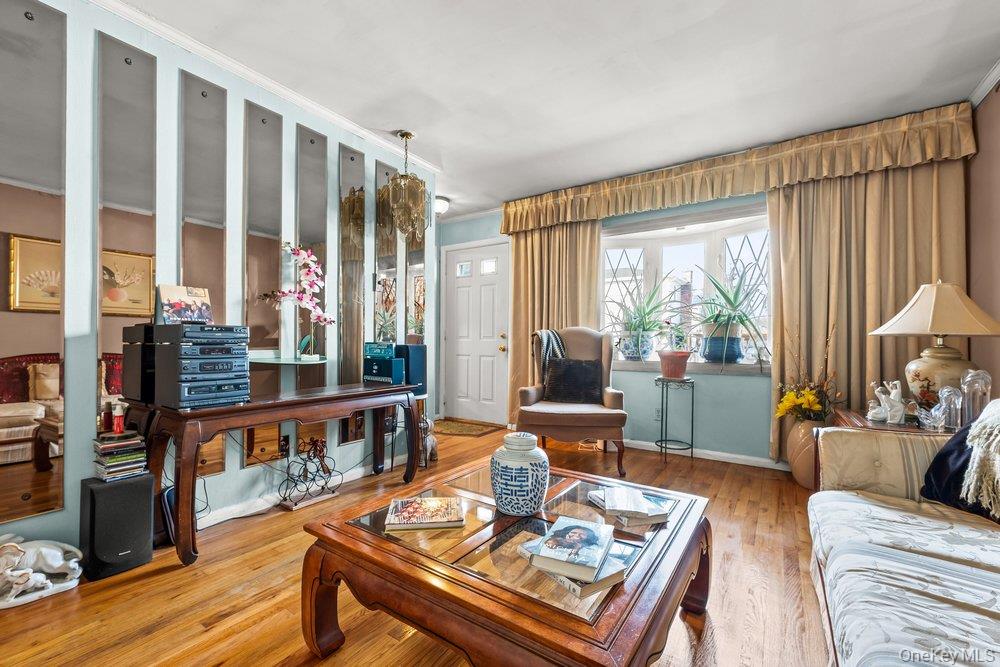 145-95 221st Street Queens, NY 11413 - Photo 5 of 38 a living room with furniture and a large window