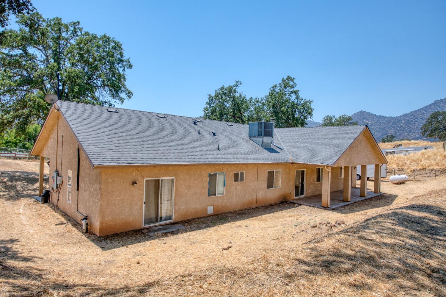 6980 Chaparral Drive Sanger, CA 93657 - Photo 11 of 41 a view of a house with a yard