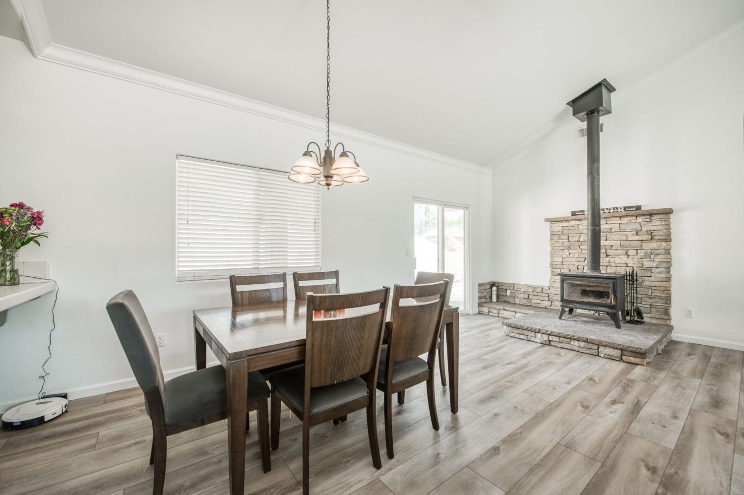 6980 Chaparral Drive Sanger, CA 93657 - Photo 20 of 41 a view of a dining room with furniture window and wooden floor