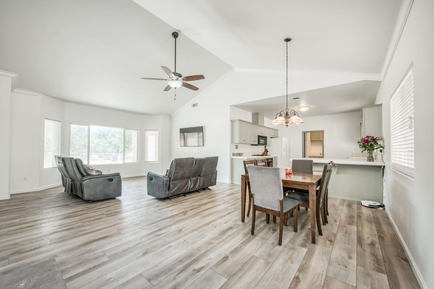 6980 Chaparral Drive Sanger, CA 93657 - Photo 22 of 41 a view of a dining room with furniture window and wooden floor