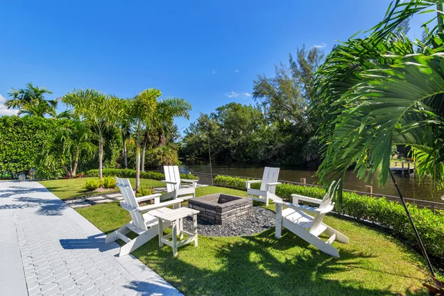 an aerial view of a house with garden space and swimming pool