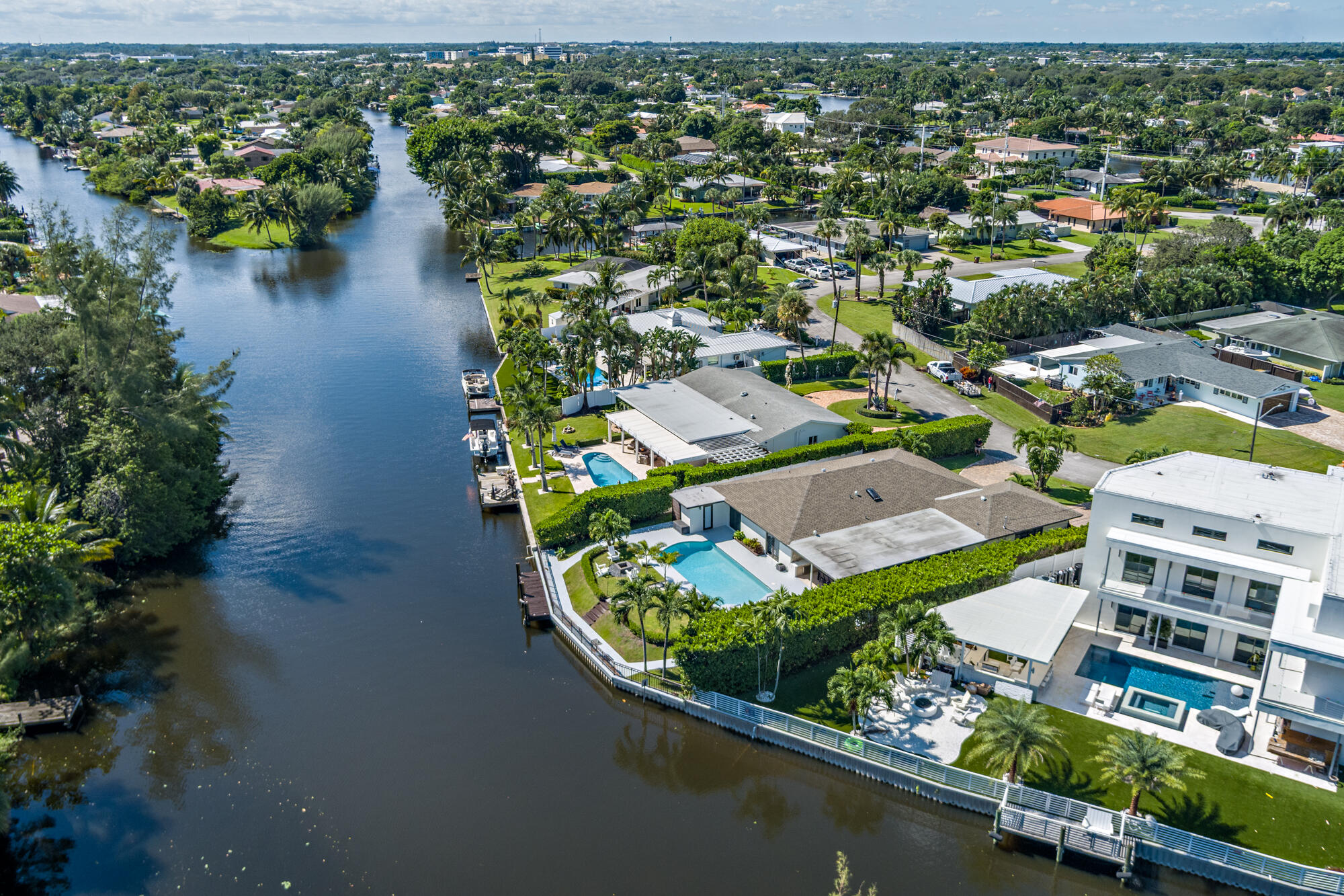 7730 Beta Circle Lake Clarke Shores, FL 33406 - Photo 2 of 50 an aerial view of a house with a lake view